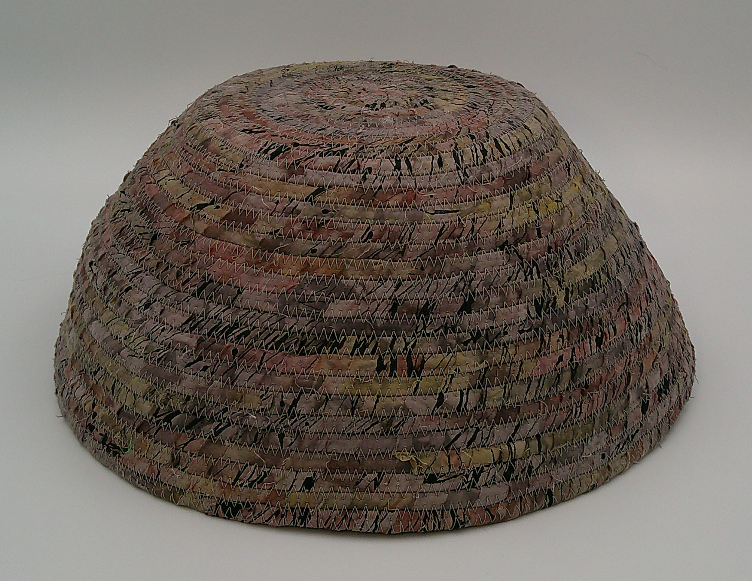 This is a side view of the bowl upside down. This is a side view of the bowl upside down.